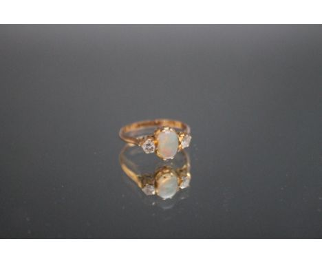 A THREE STONE OPAL AND DIAMOND RING, ring size L 1/2