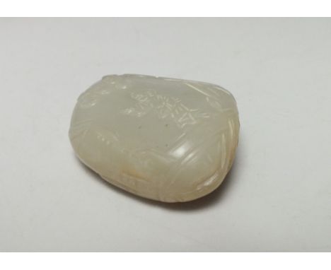 A CHINESE CELADON JADE CARVED AND PIERCED PENDANT, free-form in style with finely carved figural and foliate decoration to fr