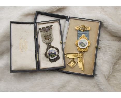 Two 1920s Masonic jewels, one in 9ct gold, the other in silver, both with enamel panel for Harlow Lodge No. 4404, each cased 
