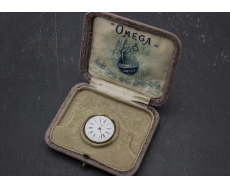 An early 20th century Omega watch box, together with a Leonidas watch movement, AF, with Clinton enamel dial (2) 