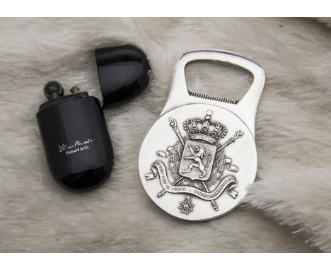 A modern cigarette lighter from Tiffany & Co, black lacquer case, marked, with bag and box, together with a Christofle silver