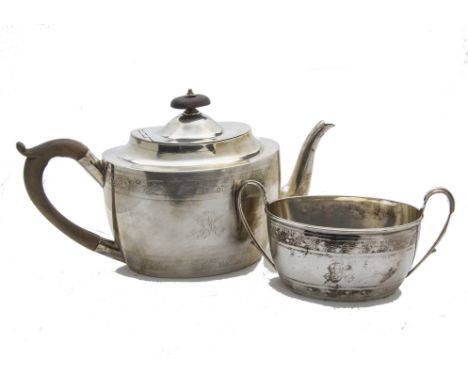 A Georgian style Victorian silver teapot and sugar basin, helmet shaped with engraved designs and initials, Birmingham 1882, 