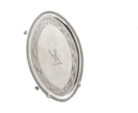 A George III silver teapot stand by John Crouch I & Thomas Hannam, oval form with bead rim, engraved well with family crest, 