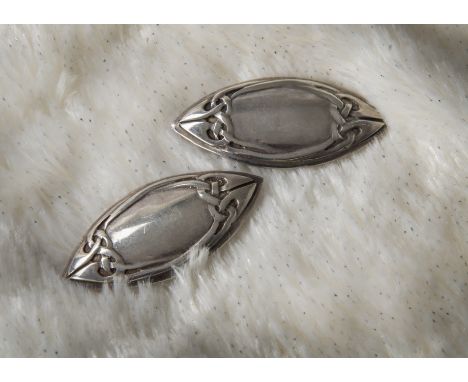 A pair of 1980s silver earrings from Liberty & Co, Celtic design to elliptical panels with clip fittings, marked Edinburgh 19