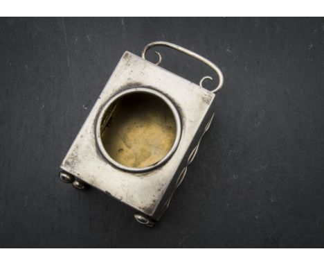 A late Victorian silver clock or pocket watch case by GB, rectangular on bun feet with swing handle and circular cut out  to 