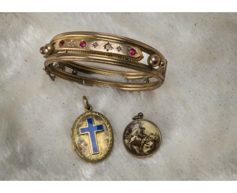 A Victorian pinchbeck bangle, set with four red gem stones and three seed pearls, together with a pinchbeck locket with blue 