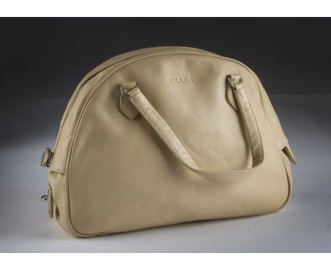 A modern Prada leather handbag, cream coloured with clasp lock zip, with a card authenticity card marked BN1013 VIT. DAINO LI