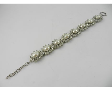 A collection of costume jewellery, to include a YSL necklace, a three strand beaded necklace, a white metal and cabouchon sto
