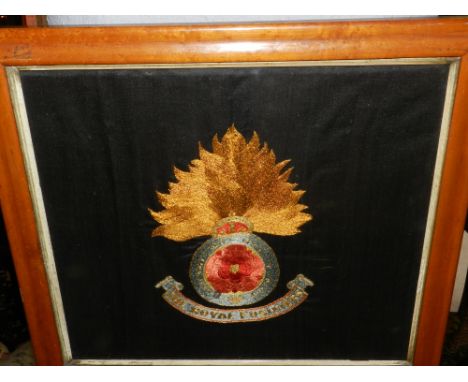 A tapestry embroidery of the Royal Fusiliers. H: 37cm W: 58cm, together with two rugby prints. 