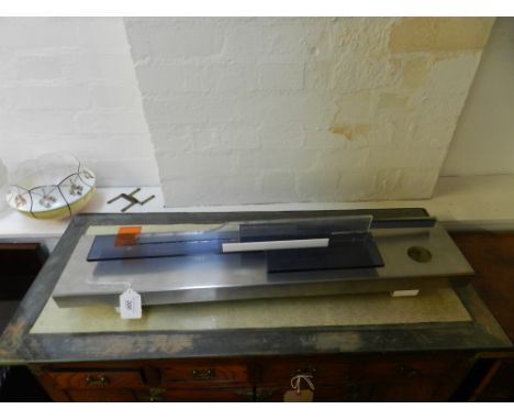 A Modernist stainless steel and perspex wall light. W.80cm 