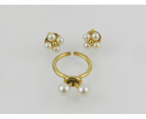 Puig Doria. An unusual yellow metal and pearl set ring, together with a pair of yellow metal and pearl earrings of floral des