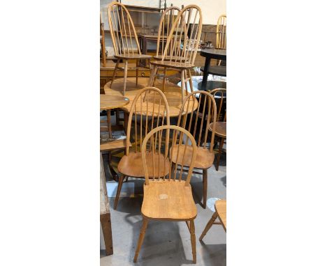 Ercol, four high hoop back blonde chairs and four similar chairs. Condition report:3 Ercol chairs match (5 stick), 1 other Er