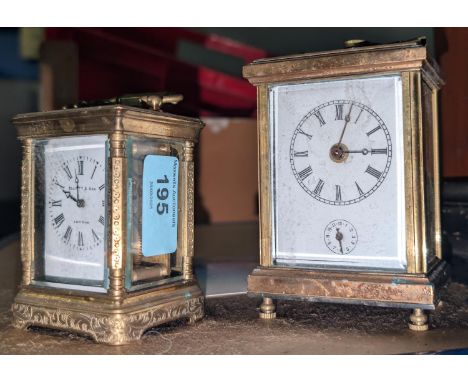 A small brass cased carriage clock by Elliot and Son, London, and another carriage clock.