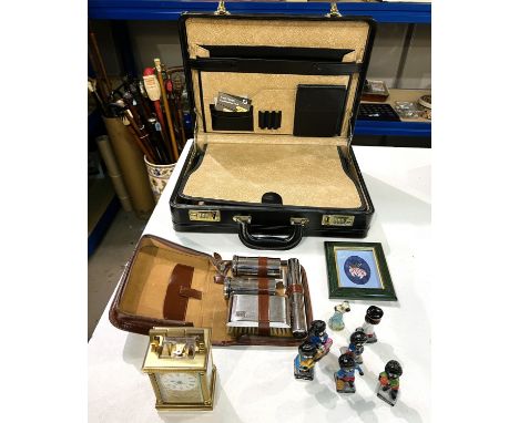A Mappin &amp; Webb gilt carriage clock, a leather briefcase and Robinson figures etc.