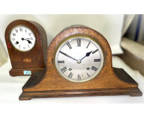 An oak cased striking mantel clock, inlaid decoration; another mantel clock with boxwood inlay.