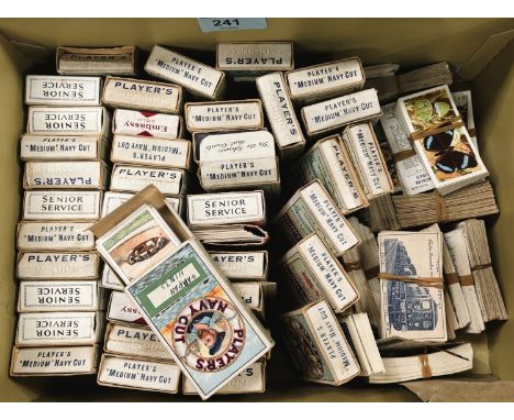A collection of cigarette card in vintage cigarette packets.