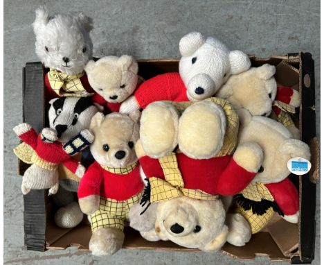 A vintage Steiff cat with label to ear and a selection of Rupert Bears.