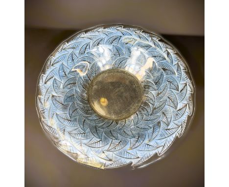 LALIQUE, a wavy circular shallow glass bowl with moulded leaves to the wide under rim shaded blue, Ormeaux pattern, dia. 32cm