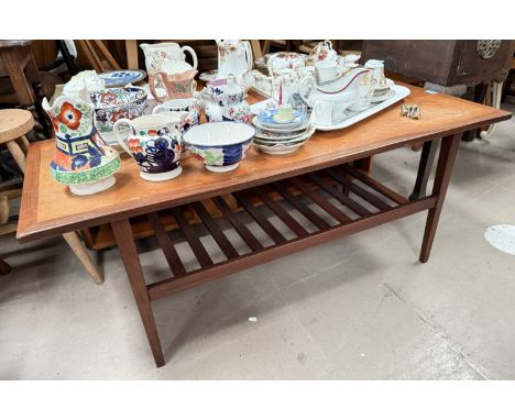A mid 20th century teak coffee table with rail shelf under, 122 x 51cm