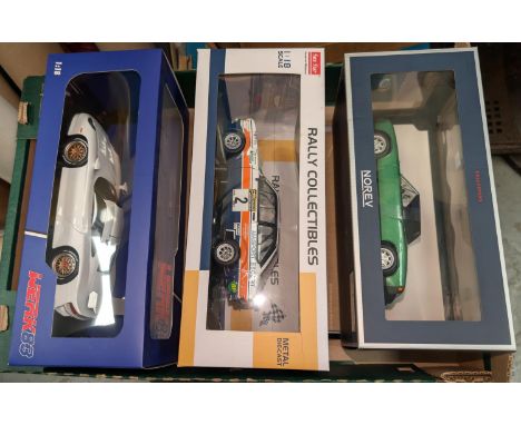 Three originally boxed scale model racing/sports cars.