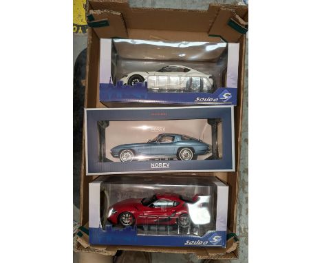 Three originally boxed scale model racing/sports cars.