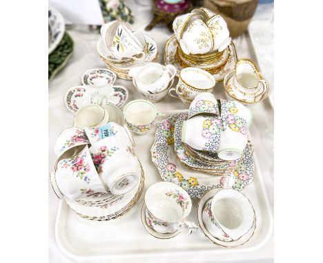A Royal Albert 'Moss Rose' part tea service, a Bell bone china green and floral Art Deco tea service; a New Chelsea bone chin