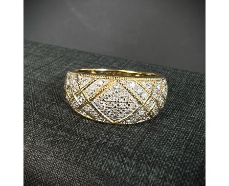 An 18ct hallmarked gold ring set with multiple small diamonds in crosshatched setting, size R, 5.9gm