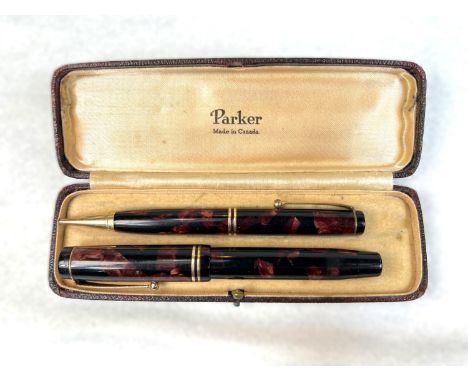 A vintage Parker Duofold made in Canada fountain pen and propelling pencil cased.
