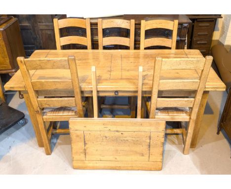 A distressed light oak farmhouse style dining suite comprising rectangular dining table with 2 spare leaves, ext. length 282c