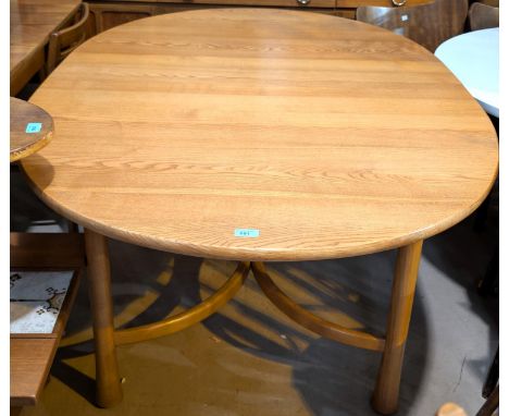 An Ercol Saville light elm and beech dining table of oval form with extending with internal leaf, 160x108cm, extended length 