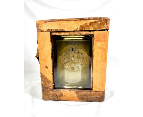 An unusually large French brass carriage clock with oval glass sides and half hour chiming movement.&nbsp; 11" high to top of