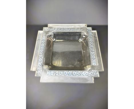 LALIQUE: a square shallow pale grey glass dish with stepped corners, the border impressed with daisies in the "Paquerettes" p