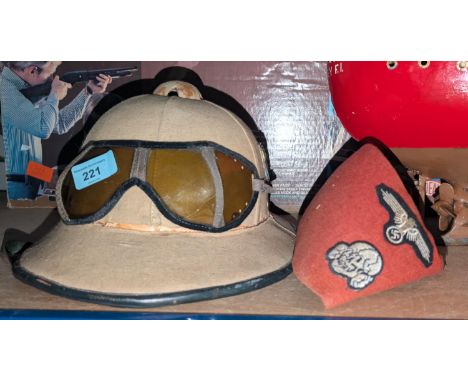 A German WWII period Africa Korps pith helmet and goggles.