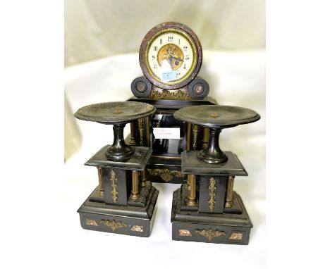 A 19th century mercury pendulum slate clock garniture with escapement mount, architectural style and a pair of tazzas with co