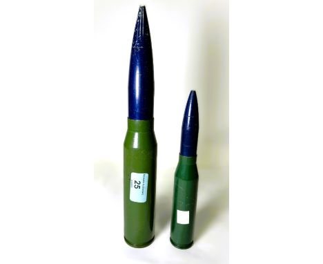 A shell case drill rounds 28.5cm, another 20.5cm.