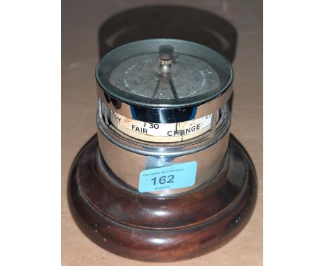 An Art Deco desk barometer with chomed detail.
