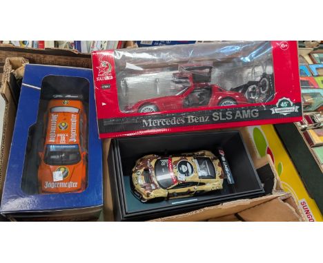 Three originally boxed scale model racing/sports cars.