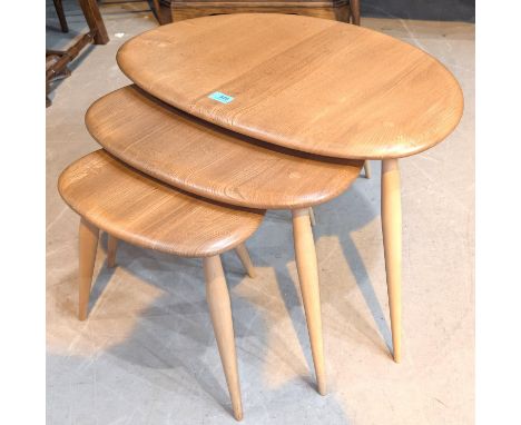 Ercol, model 354 Lucien Ercolani designed beech and elm blonde 'Pebble' nesting tables, largest 40x65x44cm.
