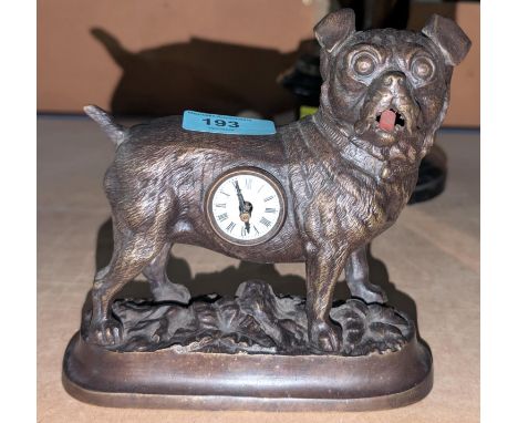 A vintage novelty mantel clock in the form of a pug with tongue that ticks.Condition report:The clock is made of brass.WE TAK