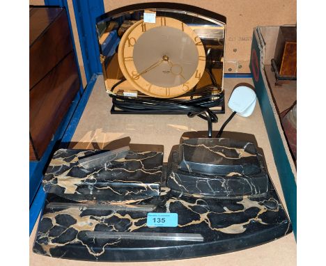 A 1930's black and brown Art Deco pen and ink stand; a 1950's peach mirror mantel clock.