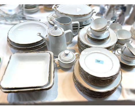 A large gilt-bordered white china dinner and tea service by Langenthal, Switzerland (approx. 60 pieces).