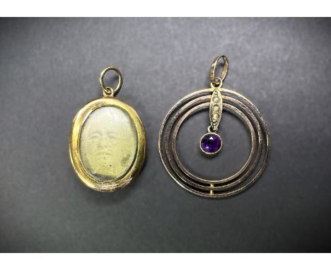 A yellow metal oval locket with seed pearl and turquoise decoration; a circular yellow metal 3 circle pendant with amethyst d