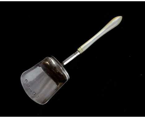 An antique George III Sterling Silver tea caddy spoon by Samuel Pemberton, London 1790 of shovel form with a polished mother 