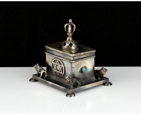 A jewelled silver Judaica box of rectangular form, on a larger base decorated with lions, raised on four feet, with removable