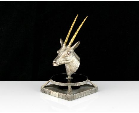 A jewelled silver oryx head statue signed Graff designed as the head of an oryx cast in silver with gilt horns and jewelled r