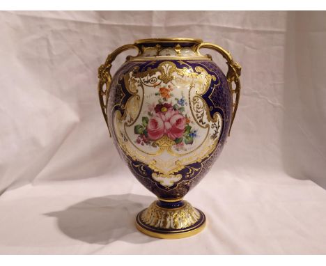 Royal Crown Derby vase by Cuthbert Gresley with twin gilt handles and floral painted against a cobalt blue ground, lacking co