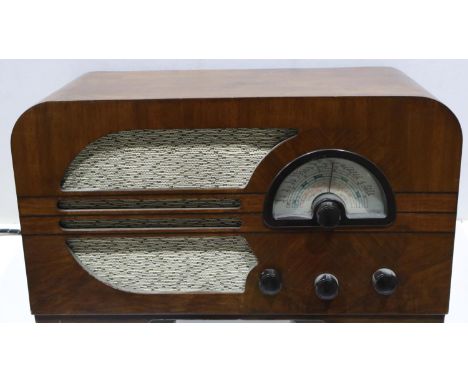 Mahogany cased Mullard valve radio. All electrical items in this lot have been PAT tested for safety and have passed. This do