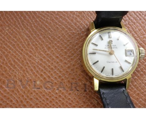 Omega Geneve automatic ladies watch with date aperture on a black leather strap, with Bulgari case, working at lotting. UK P&