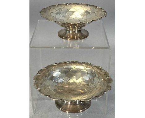 PAIR OF GEORGE V CIRCULAR SILVER BONBON DISHES with 'fish scale' decoration on circular feet, Mappin & Webb, Sheffield 1935, 