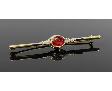 VINTAGE GOLD BAR BROOCH set with oval garnet, marked '10k', 2.5gmsProvenance: private collection Conwy